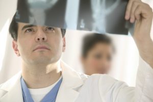 Doctor Looking at X-Rays
